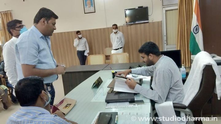 PRESENTING COFFE TABLE BOOK OF “STUDIODHARMA” TO THE DISTRICT MAGISTRATE OF MEERUT.