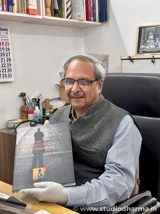 Dr Adhip Mitra Ji, the most renounced and respectable physician of Meerut with his copy of the coffee table book of StudioDharma .
